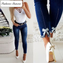 Jeans with pearl bow knot