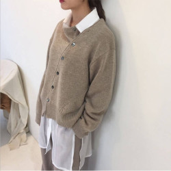 Sweater with oblique buttons