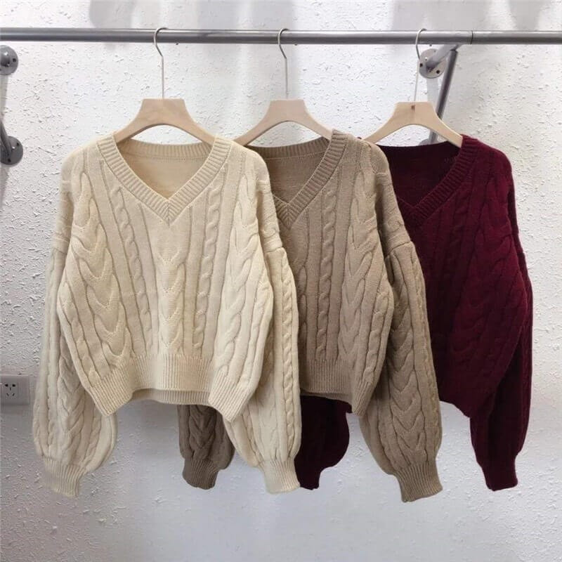 Twisted sweater with puff sleeves